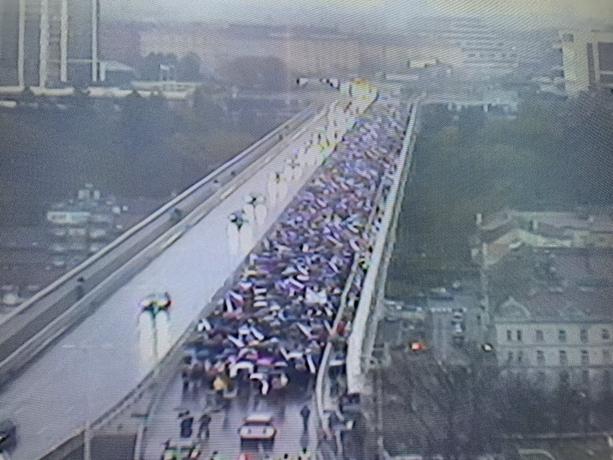 Pro-Russia crowd marching through Prague, Czech Republic. Heading to public TV HQ, where they will push to let their leader to read a statement in a broadcast. TV has already refused their request