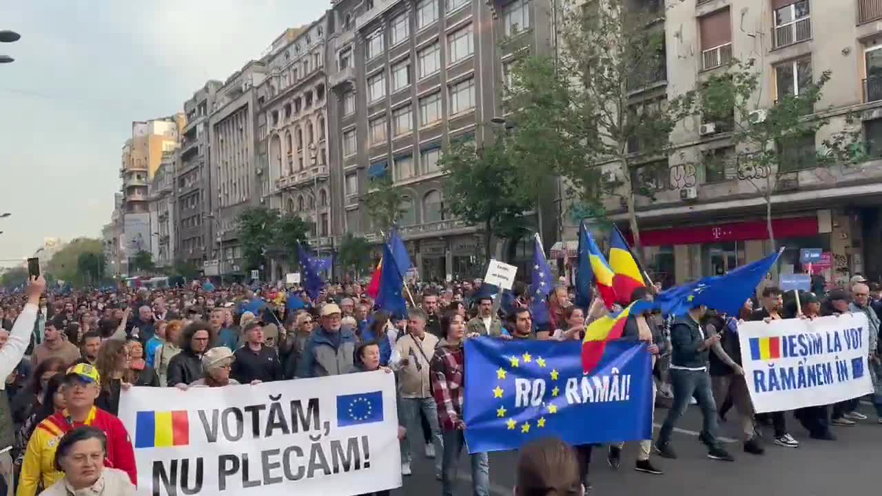 Tens of thousands of Romanians (with the number is rapidly growing) have taken to the streets of Bucharest right now. People are chanting Europe, we belong. and, as heard in the video, a chant that roughly translates to Russia, Romania will never be yours.