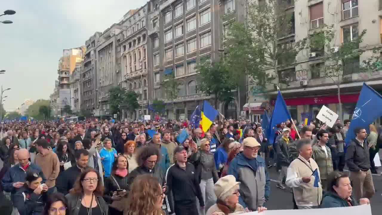 Tens of thousands of Romanians (with the number is rapidly growing) have taken to the streets of Bucharest right now. People are chanting Europe, we belong. and, as heard in the video, a chant that roughly translates to Russia, Romania will never be yours.